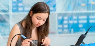 Schoolgirl In The Classroom Design And Development Of Robots