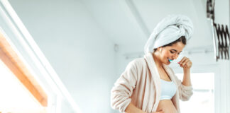 Pregnant,female,brushing,teeth,at,home