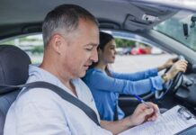 Young Woman On A Driving Test With Her Instructor