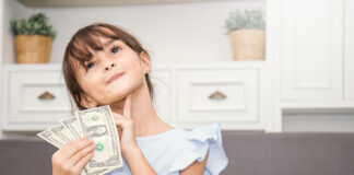 Cute Little Girl Holding Money In The Living Room, Pretty Girl T