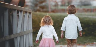 brother and sister walking without holding hands