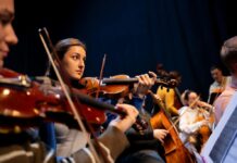 Explore These Events in Pittsburgh: Dec. 12-14 Violinists performing in an orchestra
