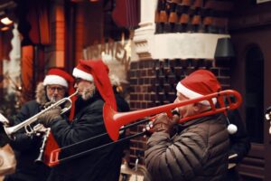 Trombone players wearing Santa hats