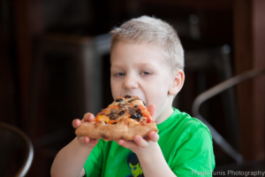 A child eating pizza