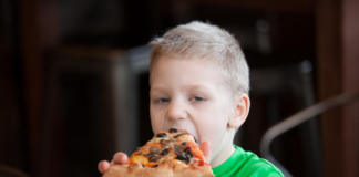 A child eating pizza