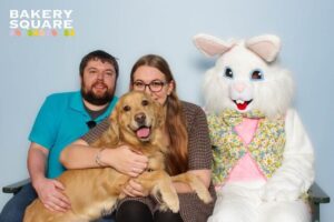 A family poses with their dog and the Easter bunny