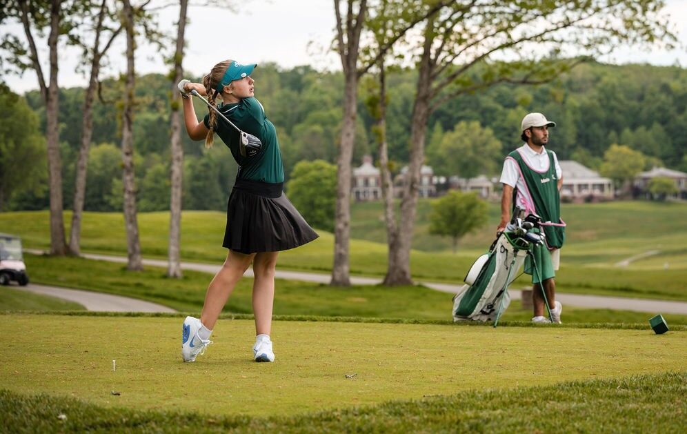 A girl playing golf