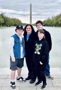 A family standing in front of the Washington Monument