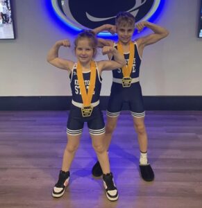 Kenzlee Taylor and cousin Brock Taylor at the Penn State Bryce Jordan Center for the 2025 Keystone State Championship. Both placed first.
