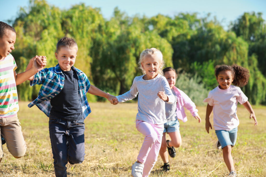 Group of running children in park 