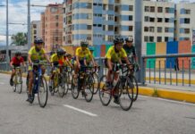 Kids riding bikes through a city