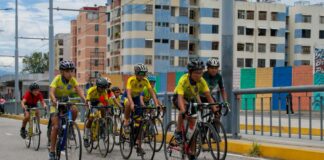 Kids riding bikes through a city