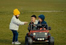 Kids riding a toy Jeep