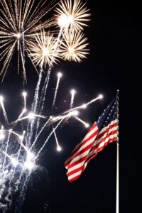 Fireworks against an American flag