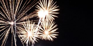 Fireworks against an American flag
