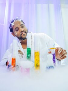 Scientist working with beakers of liquid