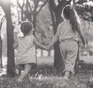 Black and white image of two girls walking