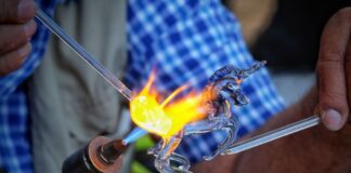 Glass being blown into the shape of a unicorn