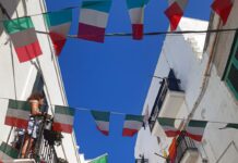 Italian flags hanging from balconies