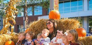A family poses with pumpkins at the Pittsburgh Monster Pumpkins Festival